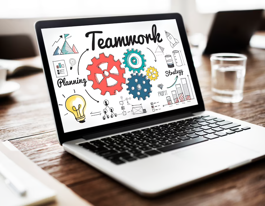 Laptop displaying a concept of teamwork, team collaboration, connection, and unity on the screen