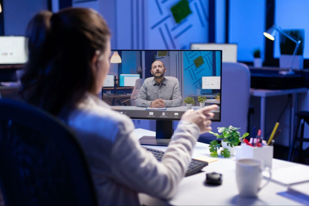 a business woman discussing custom services during an online-meeting